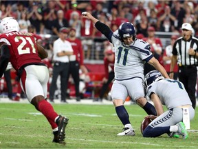 Kicker Sebastian Janikowski of the Seattle Seahawks kicks the game-winning field goal as time expires in the fourth quarter against the Arizona Cardinals.