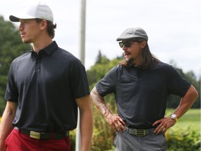 Erik Karlsson, right, and Thomas Chabot of the Ottawa Senators look on at the Royal Ottawa Golf Club during the annual Bell/Ottawa Senators Charity Golf Classic.