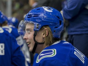 Jonathan Dahlen of the Vancouver Canucks smiles on the bench Friday while playing the Winnipeg Jets in the Young Stars Classic at the South Okanagan Events Centre in Penticton.