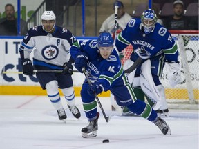 Vancouver Canucks defencemen Olli Juolevi clears the puck ouf of harm's way with an outlet pass during Friday's opening game against Winnipeg Jets prospects at the Young Stars Classic in Penticton.