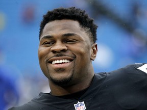 In this Oct. 29, 2017, file photo, Oakland Raiders defensive end Khalil Mack smiles before an NFL football game against the Buffalo Bills in Orchard Park, N.Y. (AP Photo/Jeffrey T. Barnes, File)