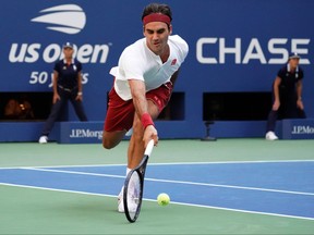 Roger Federer of Switzerland plays against Nick Kyrgios of Australia during Day 6 of the 2018 U.S. Open Men's Singles match at the USTA Billie Jean King National Tennis Center in New York on September 1, 2018. (TIMOTHY A. CLARY/AFP/Getty Images)