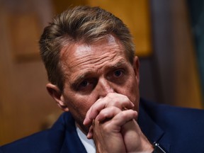 Senate Judiciary Committee member Senator Jeff Flake (R-AZ) looks on during a markup hearing on Capitol Hill in Washington, DC on September 28, 2018, on the nomination of Brett M. Kavanaugh to be an associate justice of the Supreme Court of the United States.