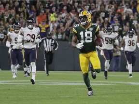 The Green Bay Packers' Randall Cobb breaks away for a 75-yard touchdown catch and run in the second half of their NFL regular season opener against the Chicago Bears at Green Bay's Lambeau Field on Sept. 9, 2018.