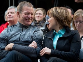 Lululemon Athletica Inc. founder Chip Wilson, left, shares a laugh with B.C. Premier Christy Clark during an announcement at Kwantlen Polytechnic University in Richmond, B.C., on Friday December 7, 2012.