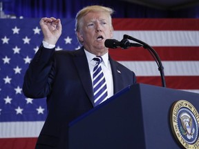 U.S. President Donald Trump gestures while speaking at the Harris Conference Center in Charlotte, N.C., Friday, Aug. 31, 2018.