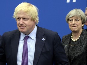 Then-British foreign secretary Boris Johnson (left) and Britain's Prime Minister Theresa May at a NATO summit heads of state and government meeting in Brussels, Belgium, in May 2017.