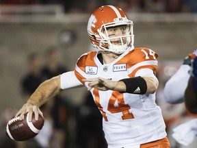 Lions quarterback Travis Lulay throws a pass during first half CFL football action against the Montreal Alouettes in Montreal, Friday, September 14, 2018.