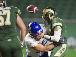 UBC Thunderbirds Dante Vigini hits University of Regina Rams quarterback Noah Picton and pops the ball loose at Mosaic Stadium in Regina.