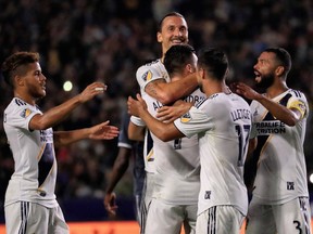 Zlatan Ibrahimovic celebrates with his Galaxy teammates during a two-goal performance that led Los Angeles to a 3-0 win over the visiting Vancouver Whitecaps at the StubHub Center in Carson, Calif., on Saturday, Sept. 29, 2018.