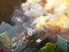 In this image take from video, firefighters battle a large structure fire in Lawrence, Mass, a suburb of Boston, Thursday, Sept. 13, 2018.