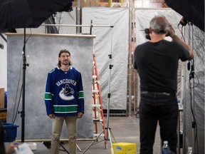 Vancouver Canucks defenceman Chris Tanev poses Thursday for his official headshot by team photographer Jeff Vinnick ahead of the NHL team's training camp.