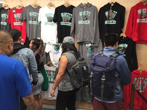 Shoppers check out the merchandise at Vancity Original's Grizzlies pop-up shop on Friday, Sept. 28, 2018.