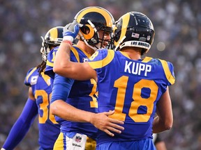 Rams quarterback Jared Goff (16) celebrates his touchdown pass with wide receiver Cooper Kupp (18) during second quarter NFL action against the Vikings at Los Angeles Memorial Coliseum, in Los Angeles, Thursday, Sept. 27, 2018.
