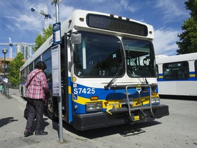 FILE PHOTO: Transit users at Surrey Central bus loop and Skytrain station Wednesday, July 26, 2017.