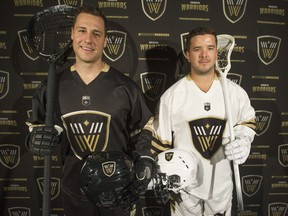 The Vancouver Canucks, new owners of Vancouver's National Lacrosse League franchise, rolled out a new name and new look for the former Langley-based Stealth squad on Friday morning at Rogers Arena. Aaron Bold, left, and Logan Schuss show off the Warriors' new jerseys.