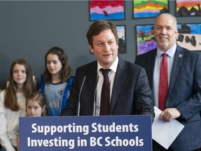 File photo: B.C. Minister of Education Rob Fleming speaks at a press conference where Premier John Horgan announces an investment in the Surrey school system in Surrey, B.C., April, 30, 2018.