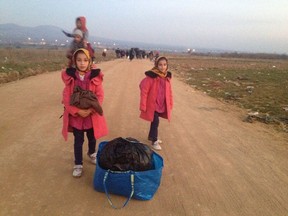 Twins Saghar and Sahar on the road s they try to find safety by walking to Europe.