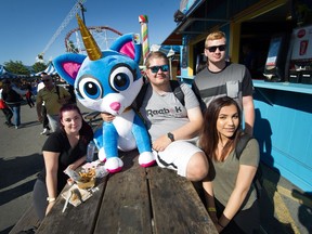 (L-R) Hailey O'Connell, Oskar Redlinski, Devon Montgomery and Kiarra Gibson joined thousands of people during the last day of The Fair at the PNE on Labour Day Monday, Sept. 3.