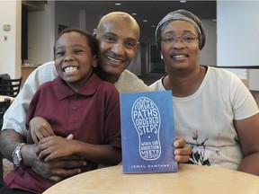 Former child soldier Jemal Damtawe with his son Adam and wife Vincia. He has written a book about the horrors of war, his fight with drugs and his discovery of Jesus.