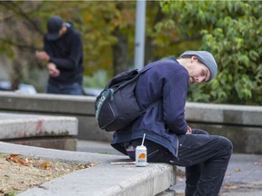 Two people injecting in the open at Andy Livingstone Park. False Creek Residents Association members are very concerned about conditions around the park and nearby Crosstown Elementary.