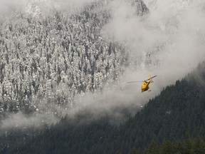DECEMBER 30, 2016 - Search & Rescue helicopters take off near the Cleveland Dam in North Vancouver, B.C., December 30, 2016. Two snowshoers, Roy Lee and Chun Lam, went missing from Cypress Mtn on Christmas day.