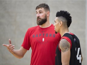 Toronto Raptors Jonas Valanciunas, left, speaks to teammate Danny Green during a team practice in Burnaby, B.C. Wednesday, Sept. 26, 2018.