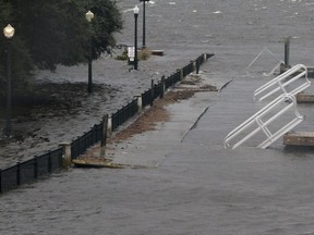 Union Point Park is flooded with rising water from the Neuse and Trent Rivers in New Bern, N.C. Thursday, Sept. 13, 2018. Hurricane Florence already has inundated coastal streets with ocean water and left tens of thousands without power, and more is to come.  (Gray Whitley/Sun Journal via AP) ORG XMIT: NCBER105