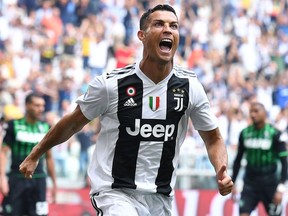 Juventus' Cristiano Ronaldo celebrates after scoring during a Serie A soccer match between Juventus and Sassuolo, at the Allianz Stadium in Turin, Italy, Sunday, Sept. 16, 2018.