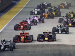 Mercedes driver Lewis Hamilton of Britain leads the field into turn one at the start of the Formula One Grand Prix of Singapore at Marina Bay Street Circuit in Singapore, Sunday, Sept. 16, 2018.