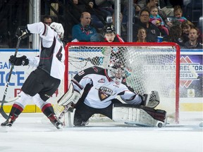 FILE PHOTO: Trent Miner of the Vancouver Giants makes a first period save on a shot by Nolan Foote #29 of the Kelowna Rockets at Prospera Place on October 3, 2018 in Kelowna, Canada.