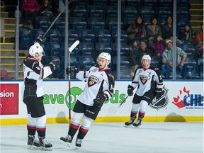 FILE PHOTO: Dylan Plouffe #6 and James Malm #14 of the Vancouver Giants celebrate a first period goal against the Kelowna Rockets  on October 3, 2018 at Prospera Place in Kelowna, British Columbia, Canada.