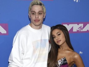 Pete Davidson, left, and Ariana Grande arrive at the MTV Video Music Awards at Radio City Music Hall on Monday, Aug. 20, 2018, in New York.