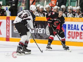 Vancouver defenceman Parker Hendren closes down on Prince George forward Ethan Browne in Vancouver's 3-0 win on Friday in Prince George.