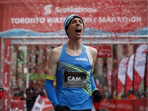Black Creek, B.C.'s Cam Levins reacts as he crosses the finish line of the Toronto Scotiabank Waterfront Marathon in Toronto on Sunday, Oct. 21, 2018. Levins broke the Canadian men's marathon record — a 43-year-old mark set by Jerome Drayton in 1975 — by running a time of two hours nine minutes 25 seconds to finish fourth overall in the race.