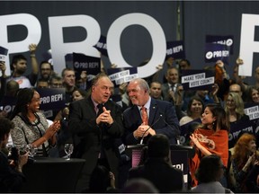 Premier John Horgan and B.C. Green Party leader Andrew Weaver following their speeches at a rally in support of Proportional Representation to help kick off the voting period for the referendum for electoral reform at the Victoria Conference Centre in Victoria.