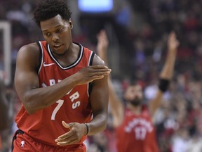 Toronto Raptors guard Kyle Lowry celebrates a three point basket against the Cleveland Cavaliers during NBA basketball action in Toronto on Wednesday, October 17, 2018.