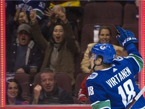 Jake Virtanen celebrates his first of two goals Wednesday.