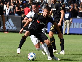 There have been too many scene like this for the Vancouver Whitecaps this season as Alphonso Davies (above) and his teammates were eliminated from MLS playoff contention on Sunday with a 2-2 draw against LAFC.
