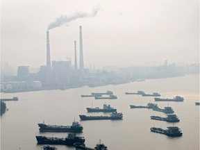 Smog in Guangzhou, looking across the Pearl River to a coal-fired power plant, was cited by Premier John Horgan for changing his tune in LNG.