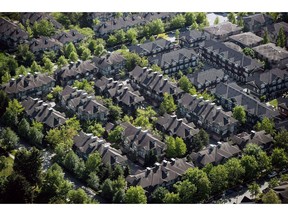 A neighbourhood of townhouses is seen in an aerial view in Richmond, B.C., on May 16, 2018. The Canadian Real Estate Association says it will soon be adding sold and historical data to its realtor.ca website.The industry group said Thursday the information will be included with new listings and be accessible without a password.