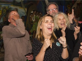 Supporters of candidate for Vancouver mayor Kennedy Stewart cheer after their candidate takes the lead in a close race with Ken Sim on municipal election night Saturday.