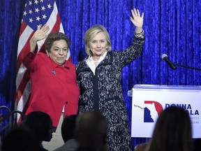 Former secretary of state Hillary Clinton joins congressional hopeful Donna Shalala at a campaign stop on Wednesday, Oct. 24, 2018 in Coral Gables, Fla. Clinton expressed her gratitude to police after a suspicious package addressed to her was seized by the Secret Service at her home in Chappaqua. N.Y.