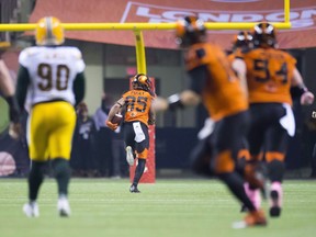 B.C. Lions wide receiver DeVier Posey, ball in hand, runs away from the opposition to score one of his three third-quarter touchdowns in the Friday, Oct. 19, 42-32 win over the visiting Edmonton Eskimos at B.C. Place Stadium, helping the Leos clinch a spot in the CFL post-season.