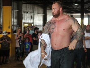 Hafport Julius Bjornsson "The Mountain" from HBO's Game of Thrones, does a victory lap for the crowd after successfully lifting a 410 pound boulder at the Strongman Competition in Fort McMurray, Sept. 9, 2017. (Olivia Condon/Fort McMurray Today/Postmedia Network)