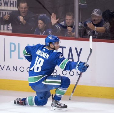 Vancouver Canucks right wing Jake Virtanen (18) celebrates his goal past the Calgary Flames during third period NHL action at Rogers Arena in Vancouver, Wednesday, Oct, 3, 2018.
