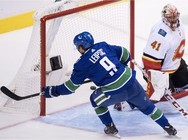 Vancouver Canucks left wing Brendan Leipsic (9) puts a shot past Calgary Flames goaltender Mike Smith (41) during third period NHL action at Rogers Arena in Vancouver, Wednesday, Oct, 3, 2018.