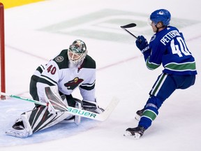 Vancouver Canucks centre Elias Pettersson scores on a breakaway against Minnesota Wild goaltender Devan Dubnyk on Monday.