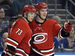 Carolina Hurricanes right wing Andrei Svechnikov, right, celebrates his goal against the Tampa Bay Lightning with left wing Valentin Zykov during the third period of an NHL preseason hockey game Tuesday, Sept. 18, 2018, in Tampa, Fla. Carolina won 4-1.