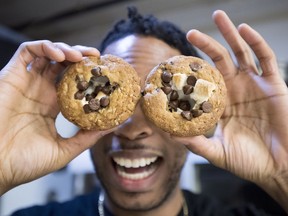 Yannick Craigwell shows off some of his edible marijuana baked treats in Vancouver, Wednesday, Oct. 3, 2018. Craigwell doesn't need to guess how large Canadians' appetites will be for edible pot products once they're legal. He already knows -- they're huge.